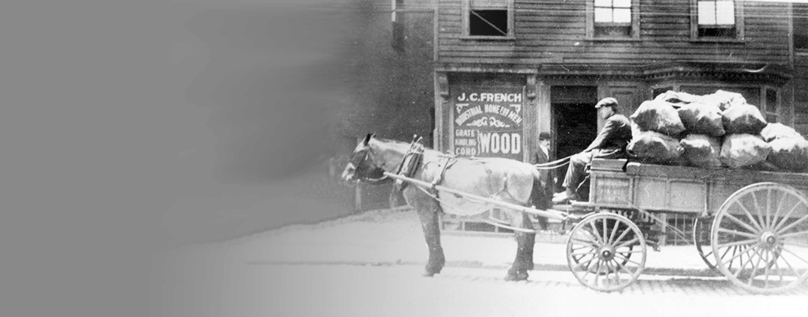 Old photo of horse pulling a wagon full of bags of produce